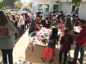 GOS Donation 09 Ecuador Gear Collection Event - University New Mexico of Women's Soccer Team with Boys and Girls Club Teams with Gift of Soccer Team Organizing Event
