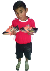 GOS Mexican child with Gift of Soccer Donated Gear