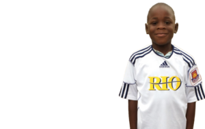 African child with Gift of Soccer Donated Gear