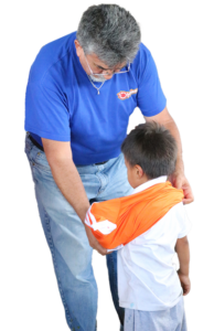 Volunteering - The Gift of Soccer Foundation Elohim Member helping deliver Soccer Gear