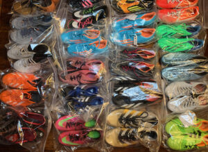 Our Mission - Gift of Soccer Foundation Soccer Cleat Background 01
